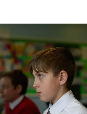 Male school pupil in a classroom.
